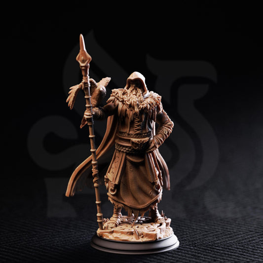 A detailed figurine of a bearded man holding a spear and a bird, standing on a base against a dark background.