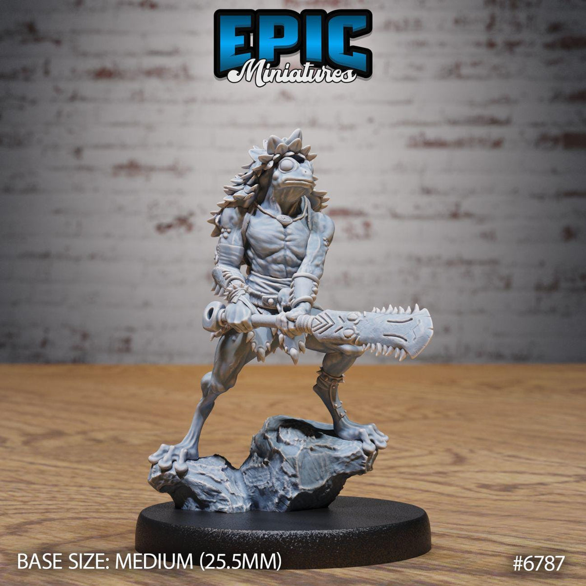 A figurine of a warrior-like character with a large weapon, standing on a rock formation against a brick wall background.