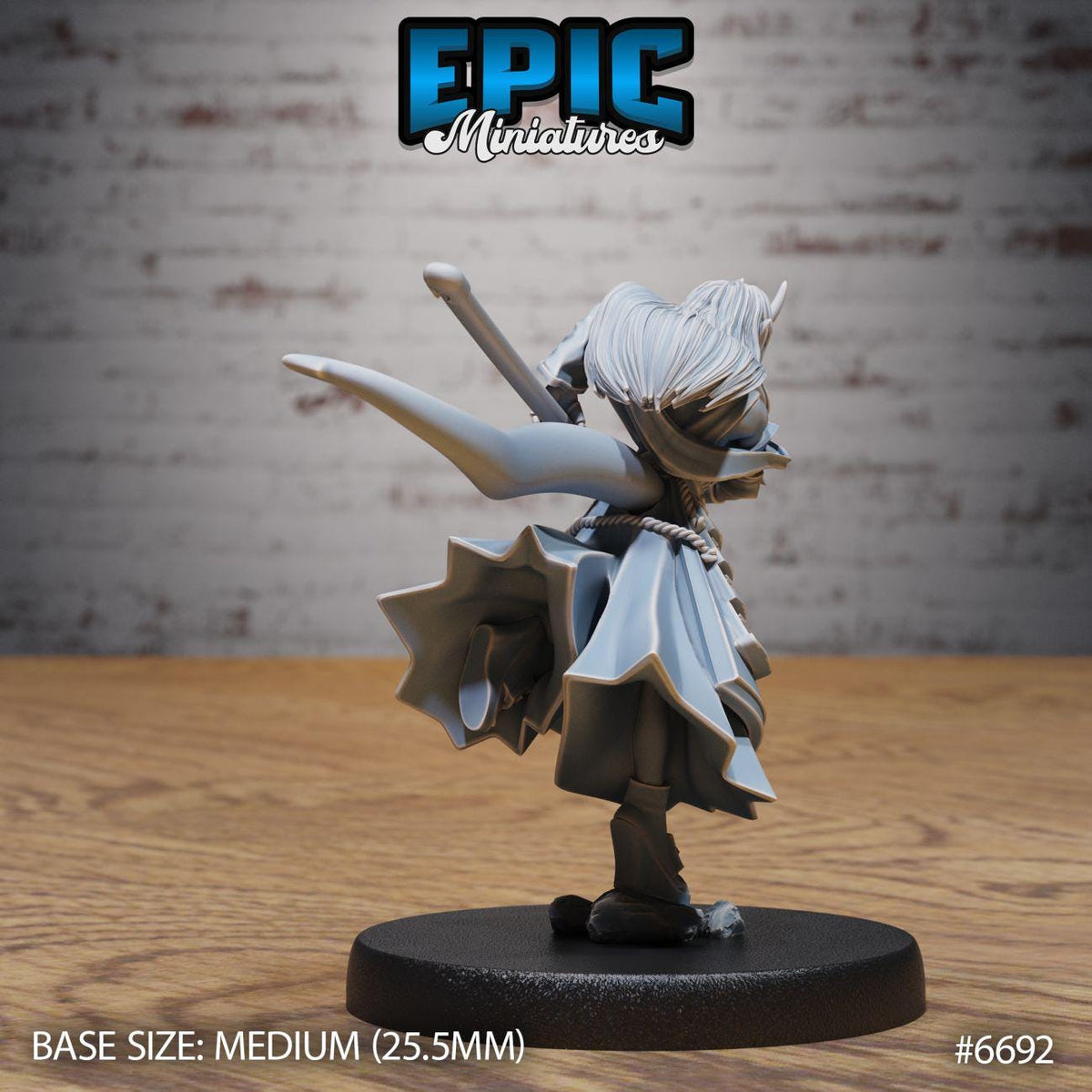 A figurine of a character with a large head and a flowing cape, standing on a black base.