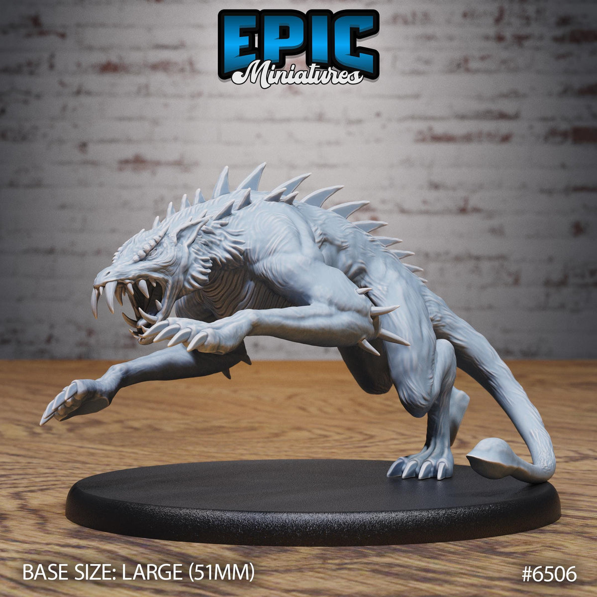A large, detailed model of a fierce-looking creature with sharp teeth and claws, displayed on a black circular base.