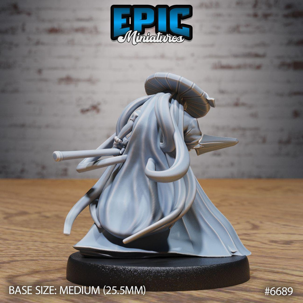 a figurine of a character with a long, flowing robe and a hat, sitting on a black base.