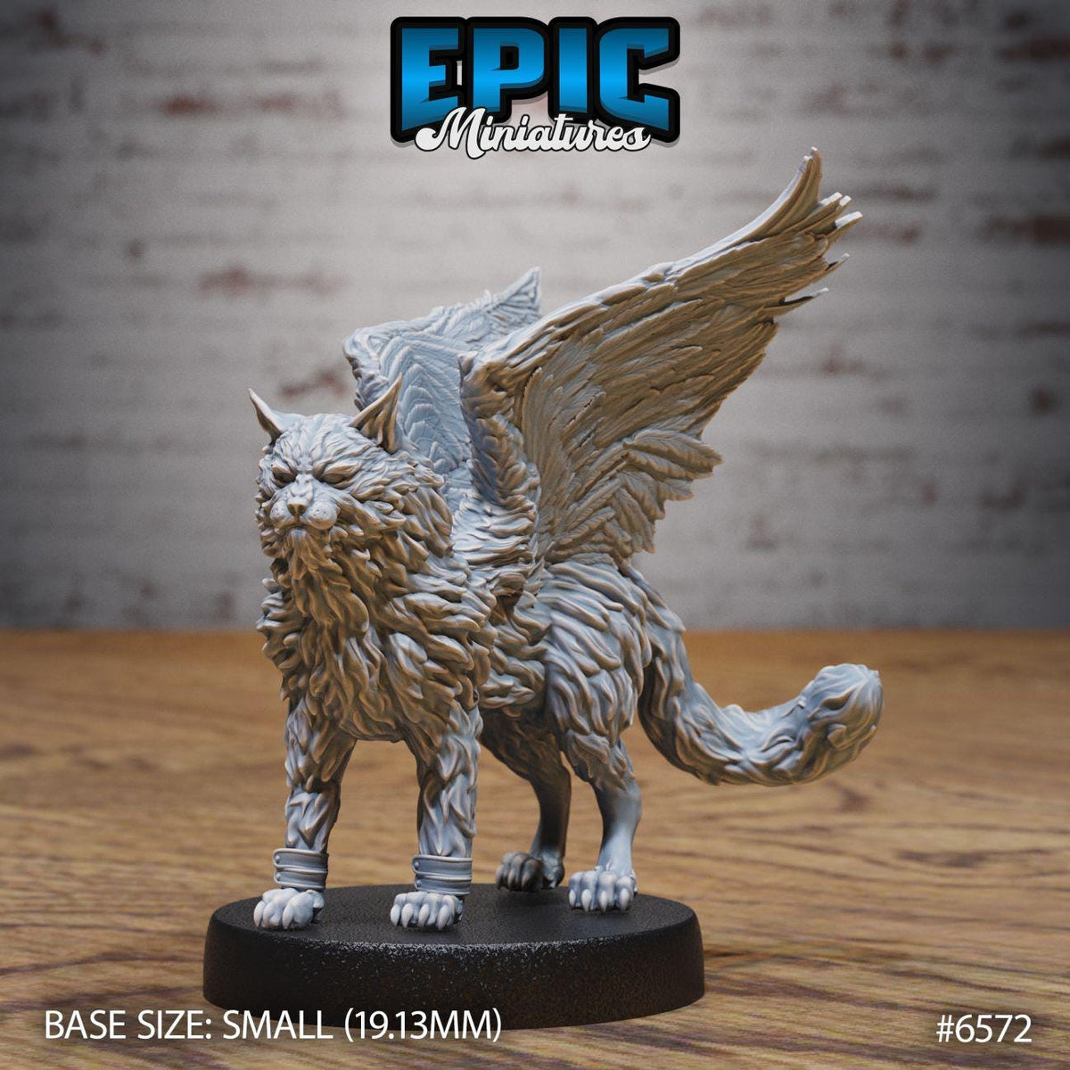A small figurine of a winged cat, possibly a deity or mythical creature, with a detailed and intricate design.