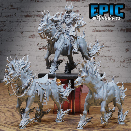 three detailed figurines of fantastical creatures, including a knight on horseback, set against a brick wall background.