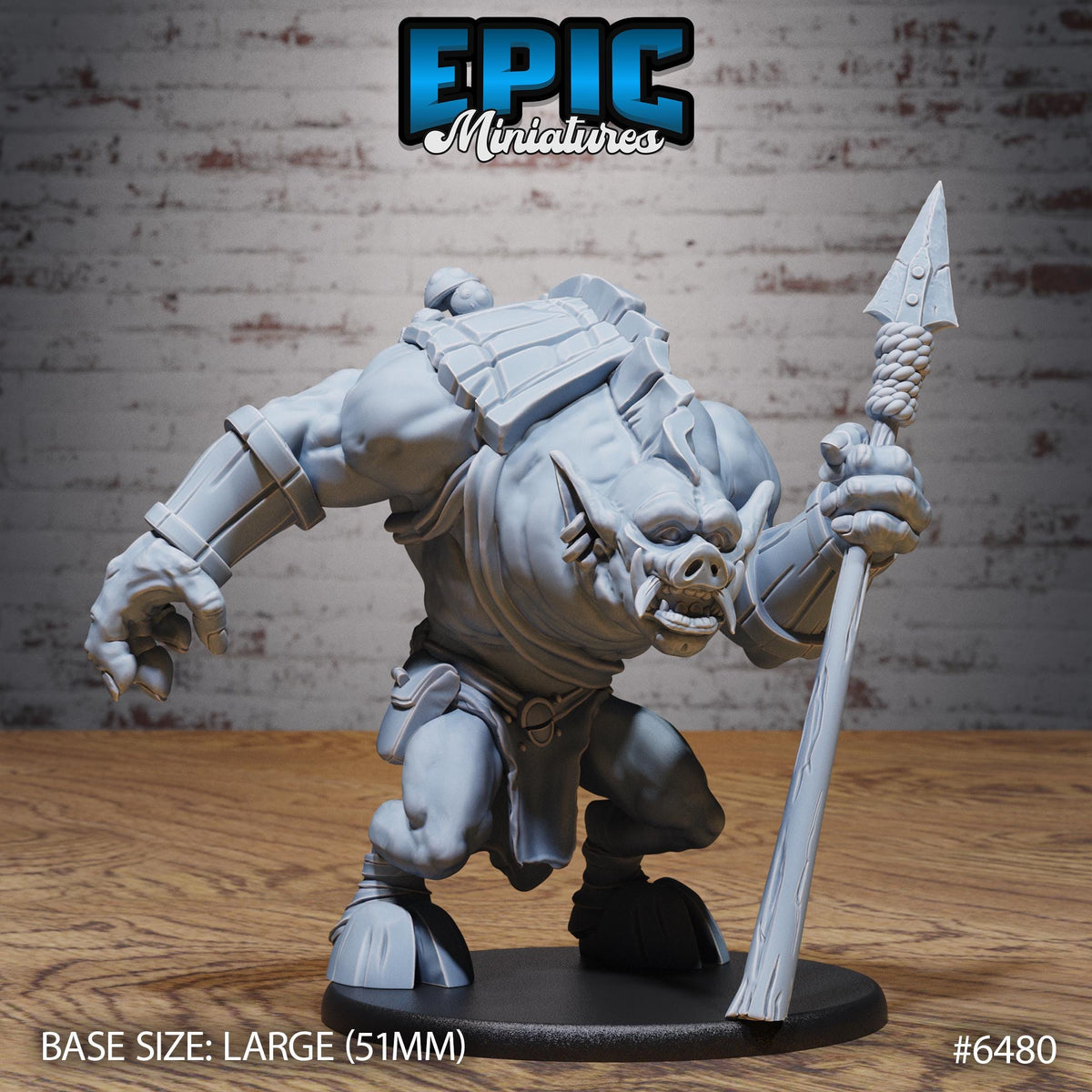 A large gray figurine of a monster-like creature holding a spear and standing on a black base.