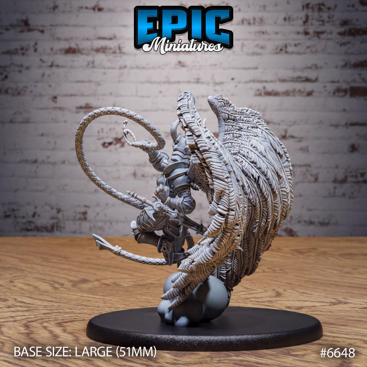 A large figurine of a winged creature with intricate details, displayed on a black base.