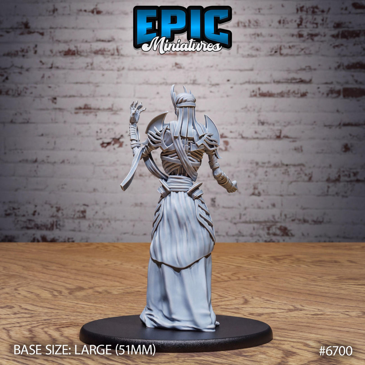 A figurine of a warrior standing on a black base, with a brick wall in the background.