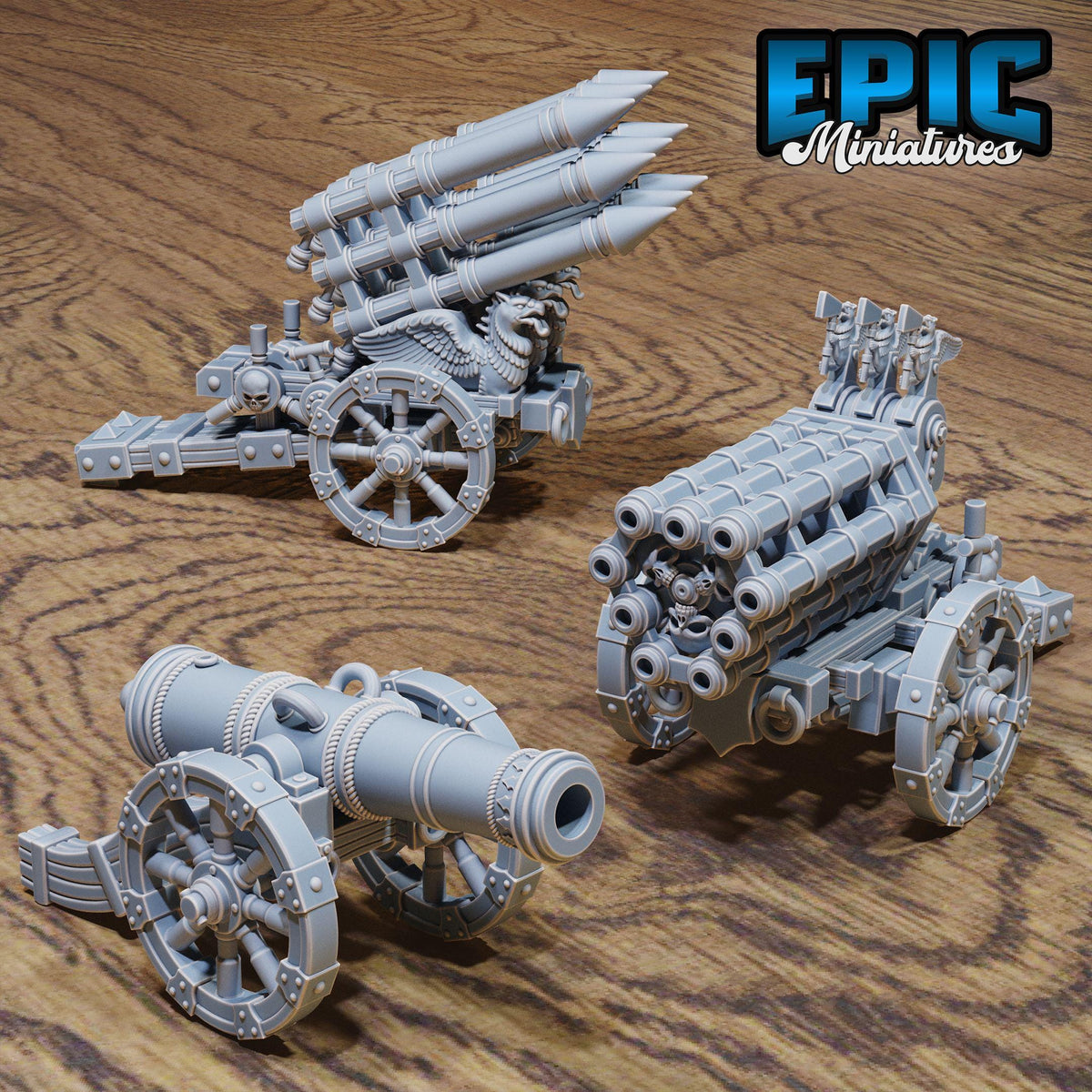 three miniature cannons or cannons with multiple turrets, arranged on a wooden surface.
