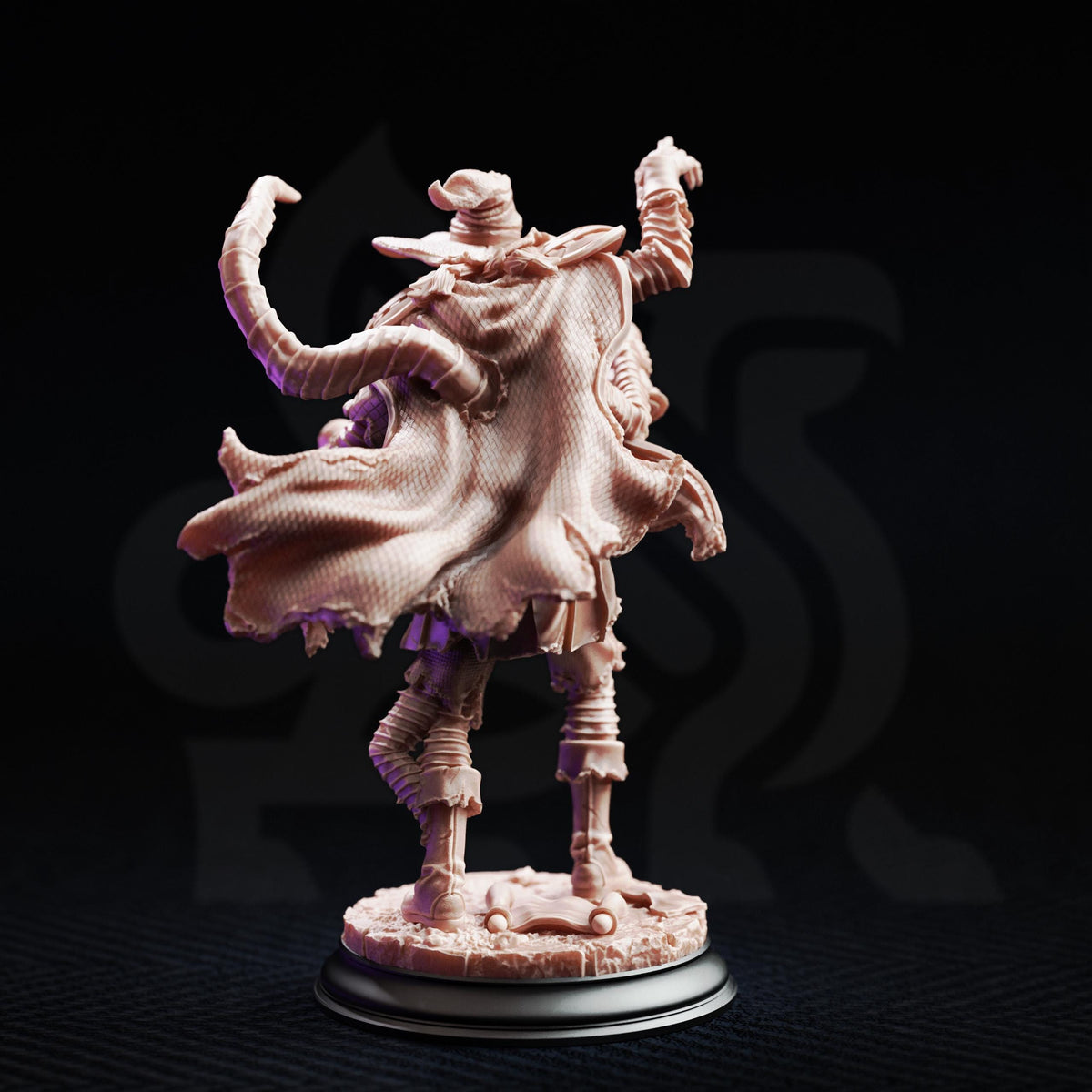 A figurine of a person with a flowing cape and a pointed hat, standing on a base and holding a weapon.