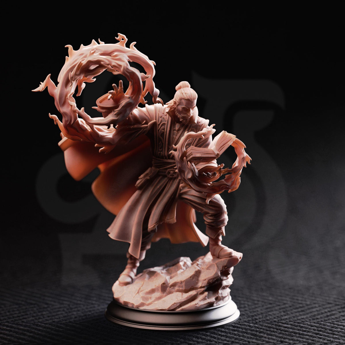 A figurine of a person with a flowing robe and holding a staff, standing on a rock and surrounded by flames or fire.