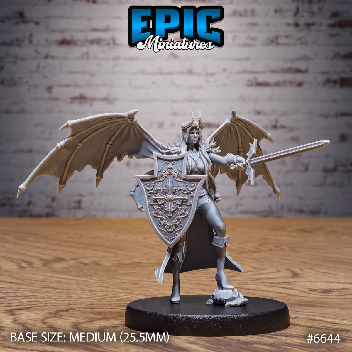 A figurine of a winged warrior standing on a base, holding a shield and sword, with a brick wall in the background.