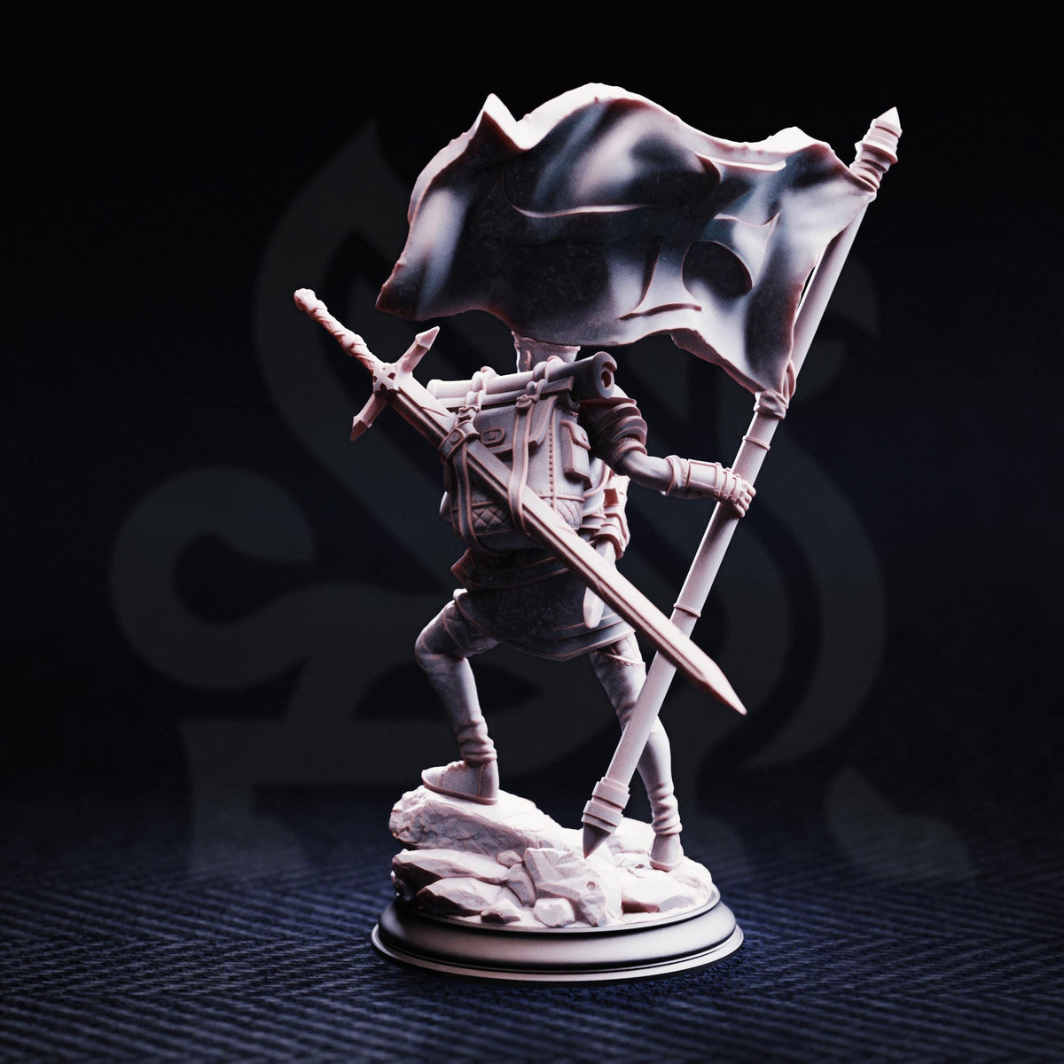A figurine of a person holding a flag and a sword, standing on a rock base against a dark background.