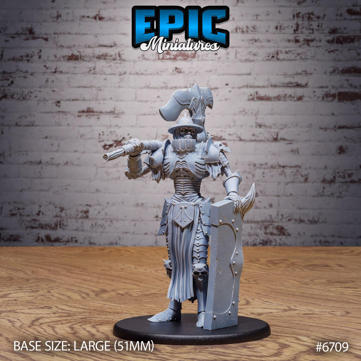 A figurine of a knight in armor, standing on a black base and holding a shield. The figurine is set against a brick wall background.