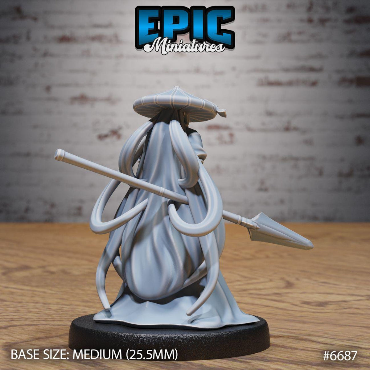 A figurine of a character with long, flowing hair and a pointed hat, holding a spear, is displayed on a black base.