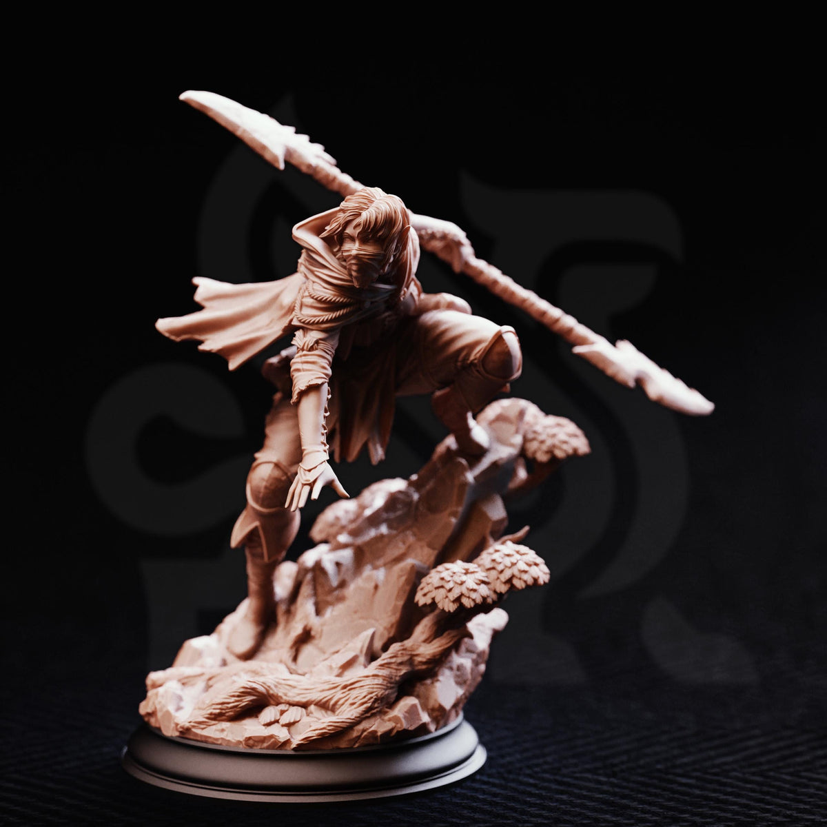 A detailed figurine of a warrior wielding a spear and shield, standing on a rocky base against a dark background.