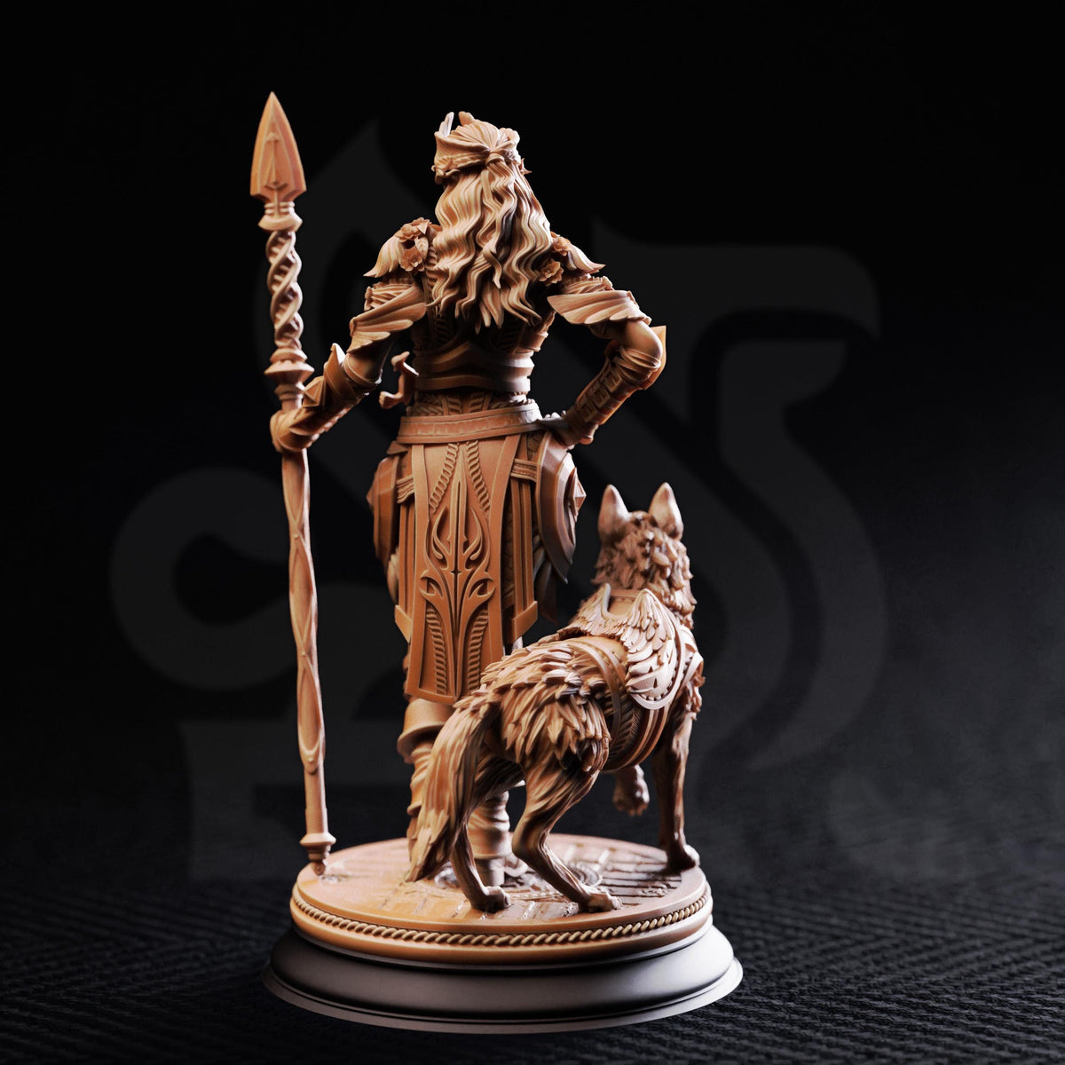 A bronze statue of a warrior standing with a spear and a dog.