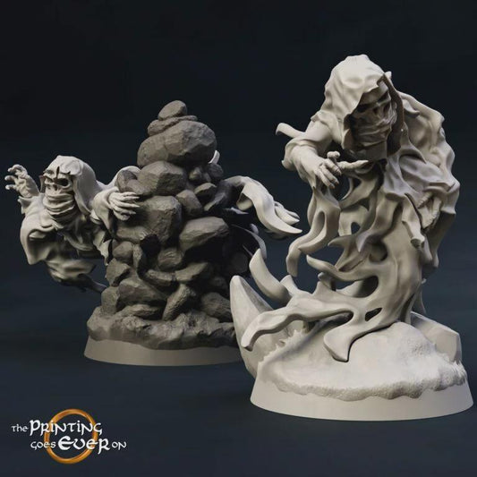 two sculptures of ghostly, ethereal figures against a dark background.