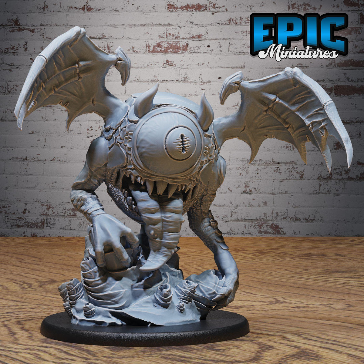 A 3D model of a fantastical creature with wings, sharp teeth, and a large eye, displayed on a wooden base against a brick wall background.