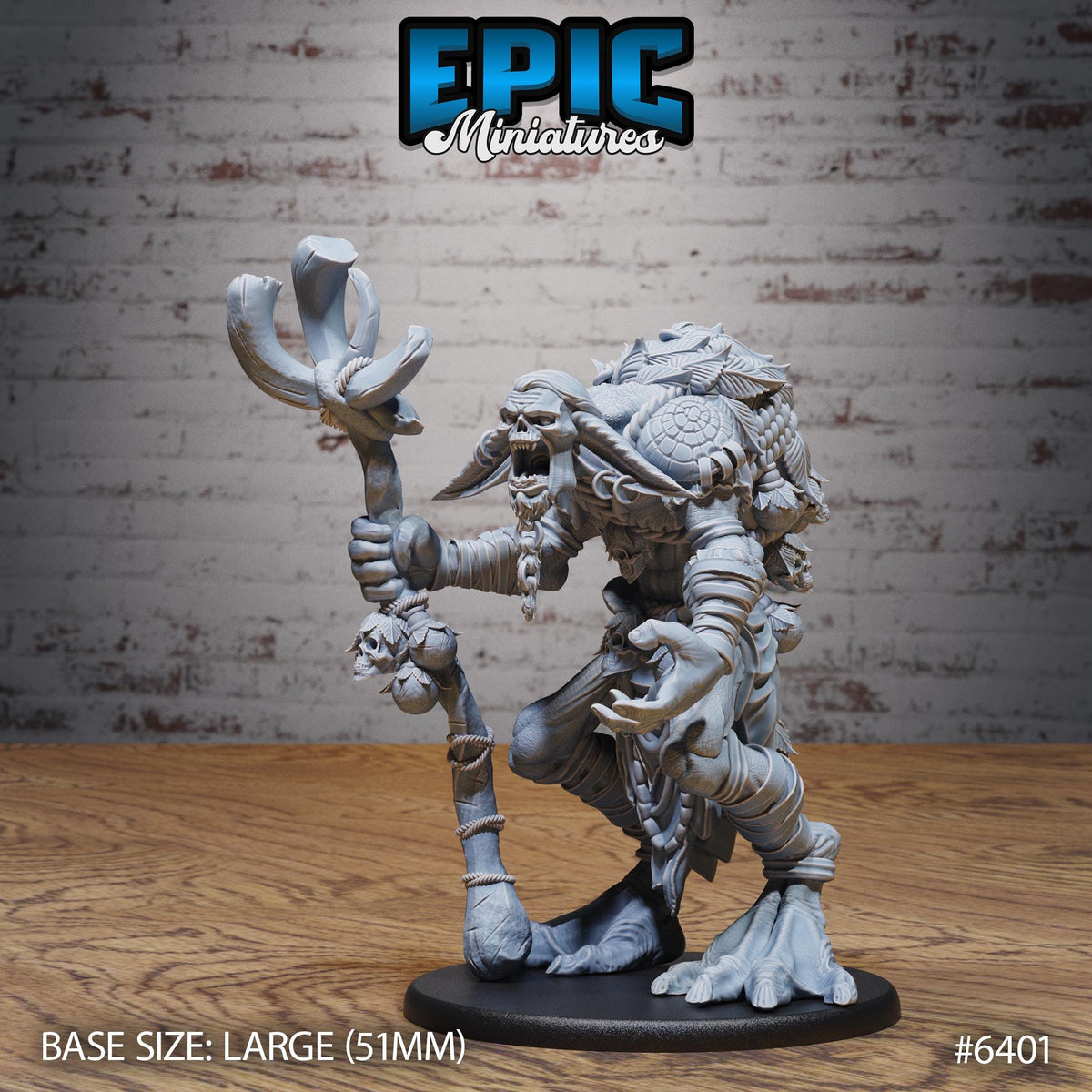a large figurine of a monster or dragon-like creature, possibly a character from a fantasy or adventure game. The figurine is standing on a wooden surface and appears to be made of a material that resembles stone or metal. The background is a brick wall, which adds to the overall aesthetic of the image. The figurine is described as being "large" and "51mm" in size, indicating that it is a sizable and detailed representation of the character.