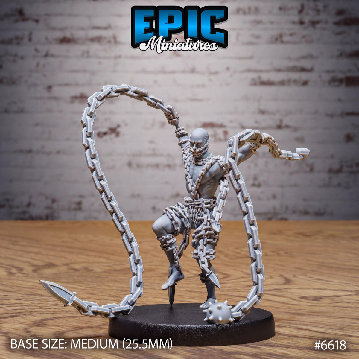 A figurine of a chained figure, likely a miniature model, with a chain around its neck and a chain-link weapon in its hand. The figurine is placed on a black base, and the background is a brick wall.