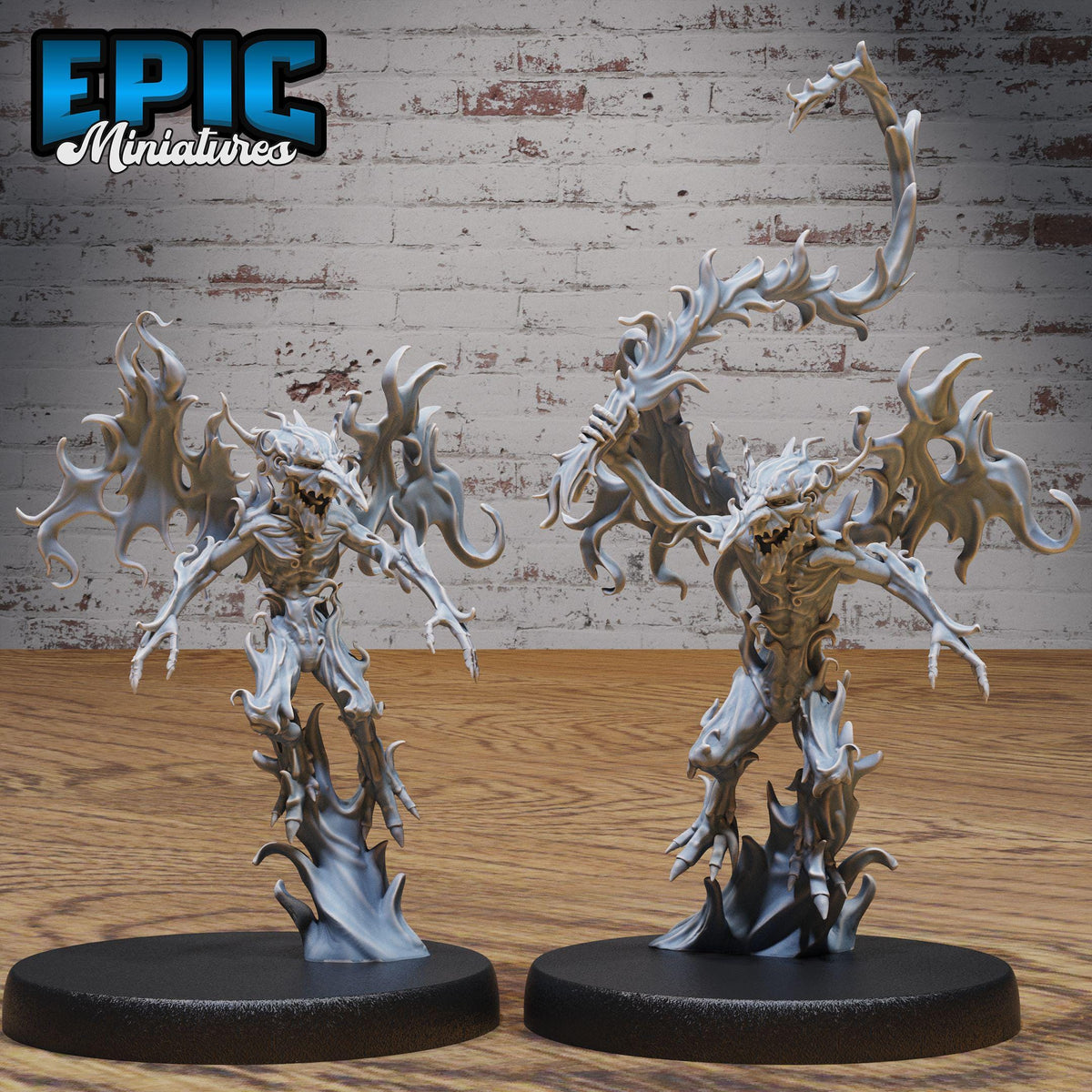 two figurines of fantastical creatures, possibly mythical or magical, standing on a wooden surface against a brick wall background.