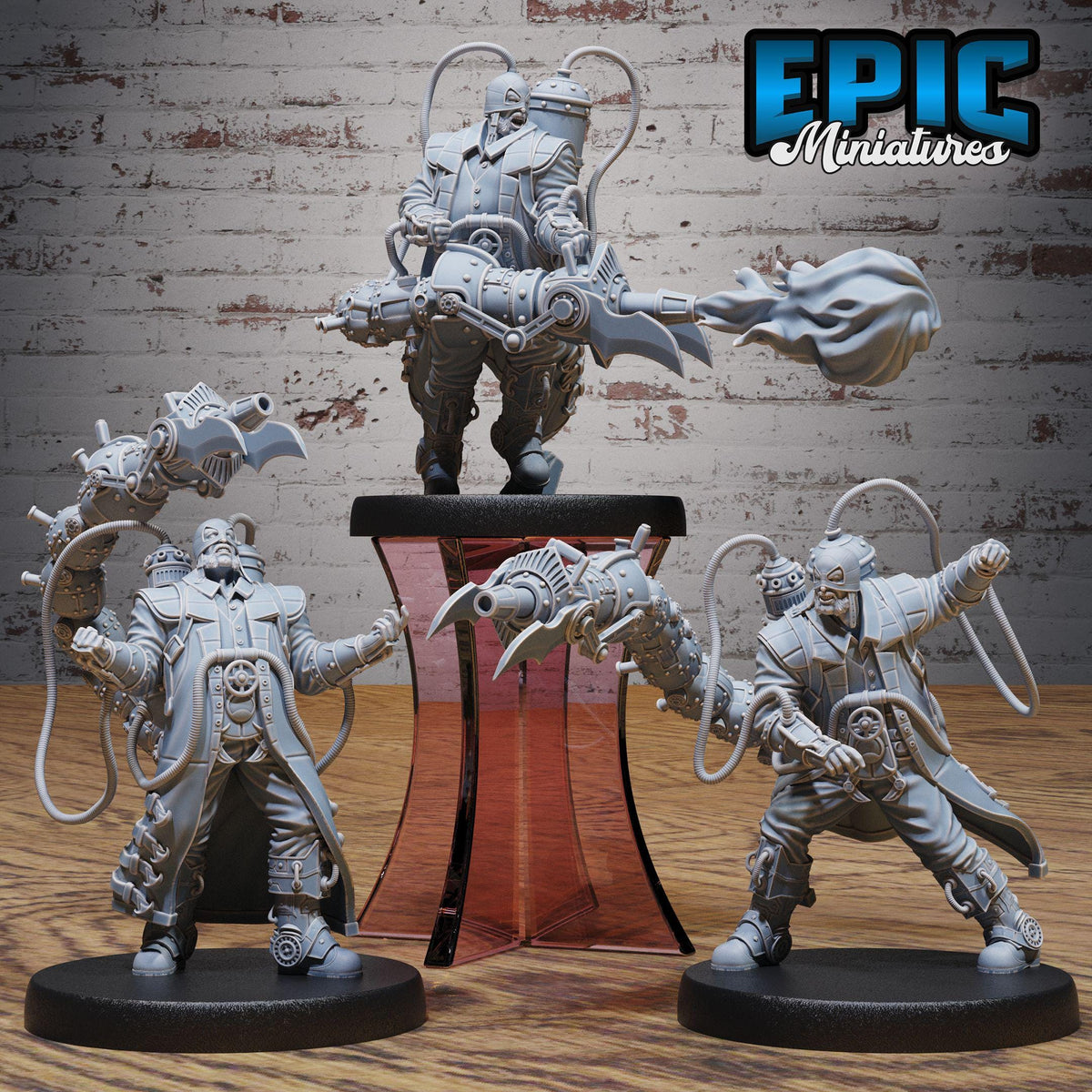 a group of three figurines, each with unique poses and weapons, set against a brick wall background.
