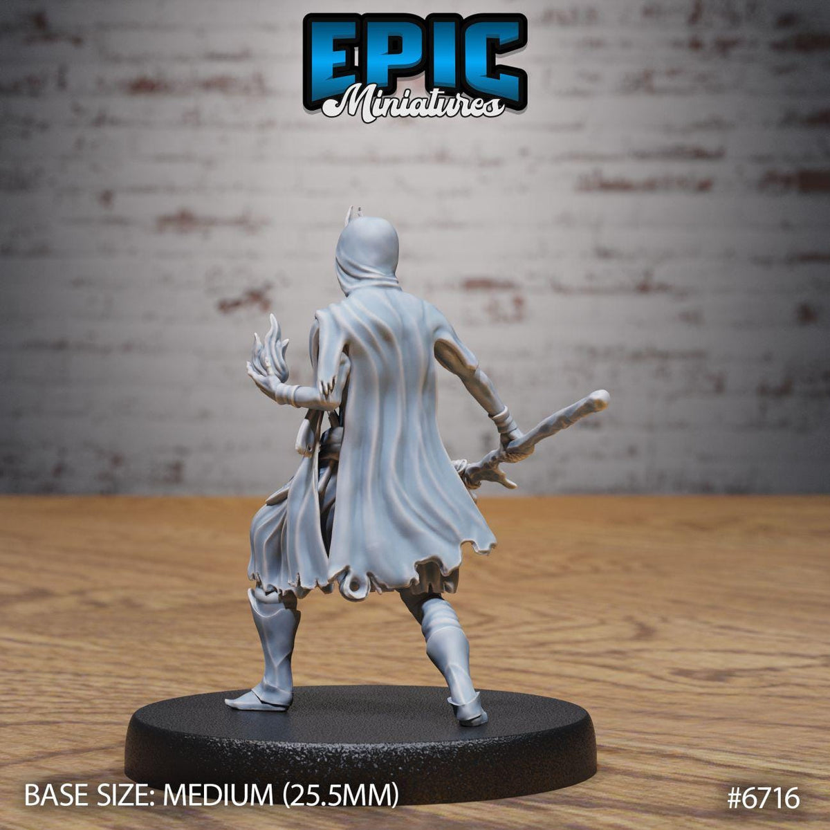 A figurine of a person in a cape and holding a weapon, standing on a black base.