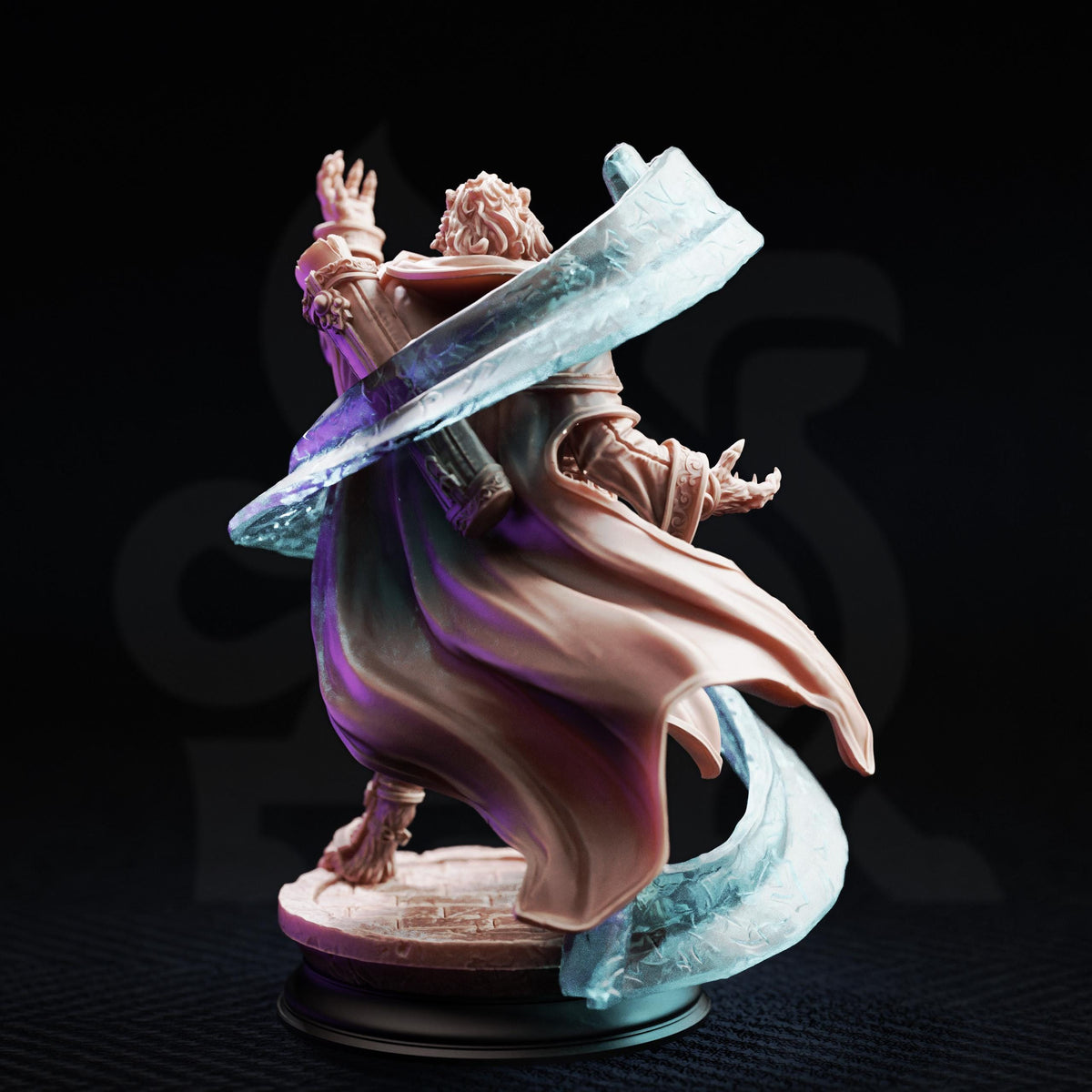 A figurine of a person with a flowing cape and a sword, standing on a pedestal against a dark background.