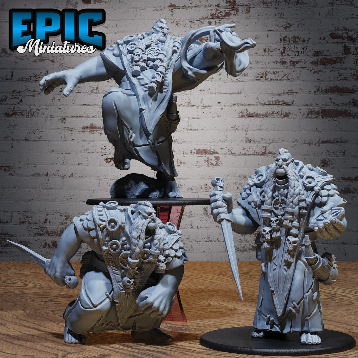 three detailed, intricately designed figurines of fantastical creatures, likely from a miniature tabletop game.