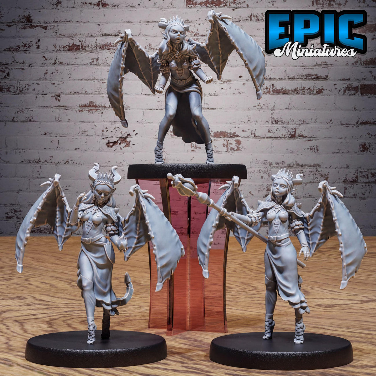 three figurines of winged, winged-haired, winged-winged female characters, each with unique poses and accessories.