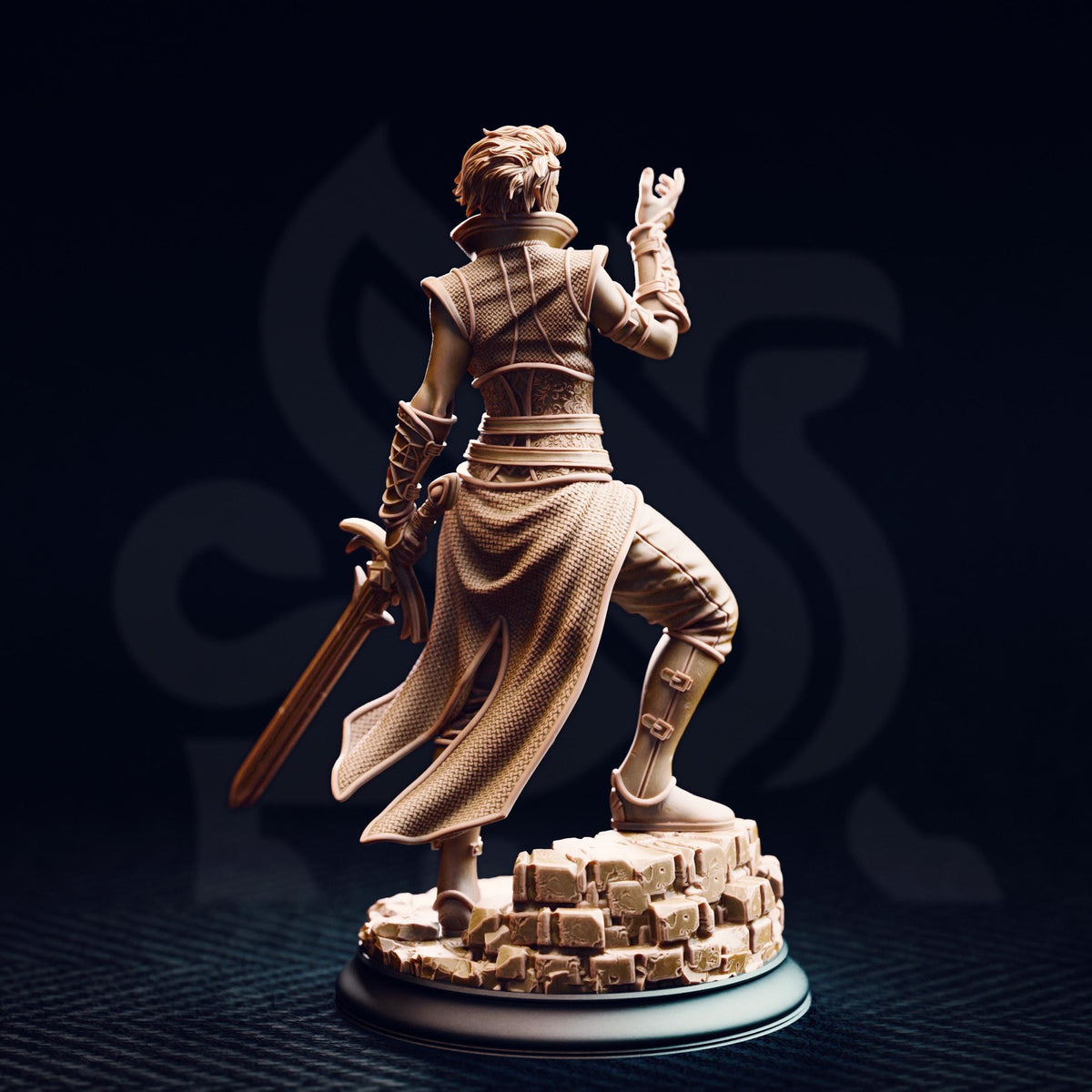 A statue of a person holding a sword and standing on a rock base against a dark background.