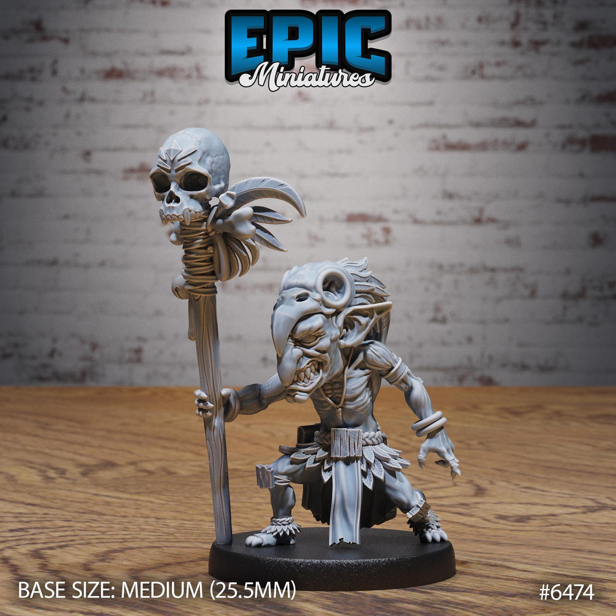 a miniature figurine of a character with a skull-like head and a staff-like staff, standing on a wooden surface.