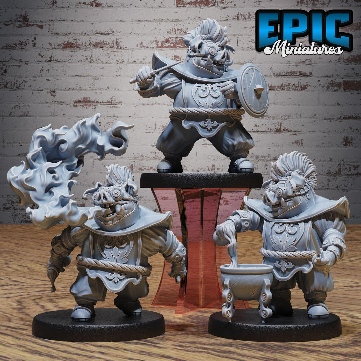 three figurines of fantastical creatures, including a dragon, a unicorn, and a dragon-like creature, all posed on a wooden surface against a brick wall background.