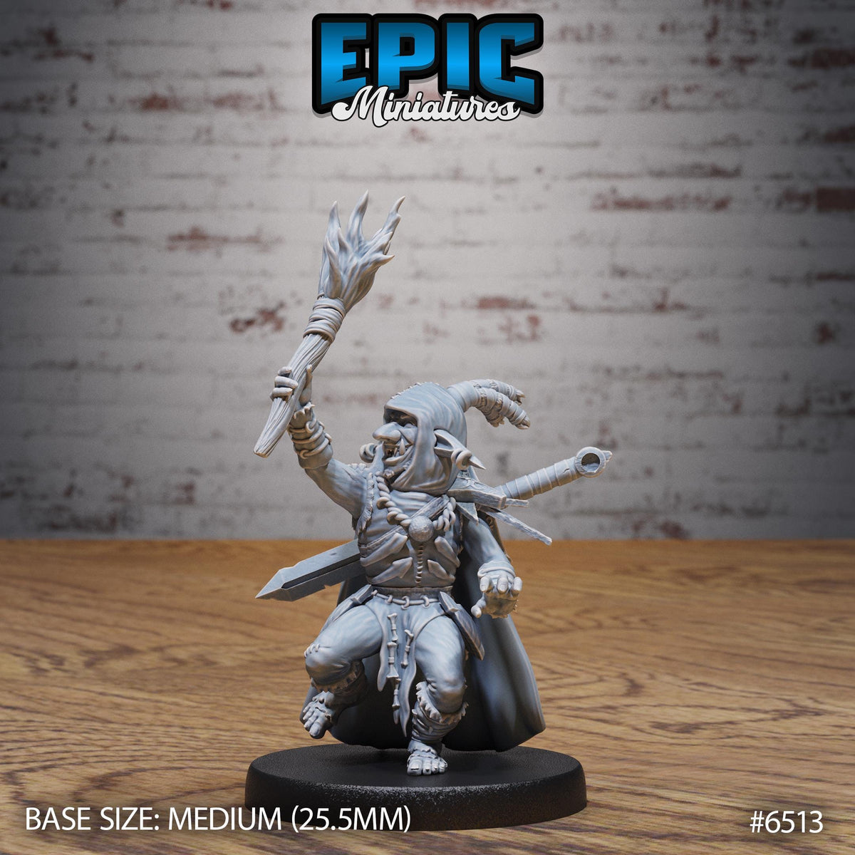 A figurine of a warrior character, likely from the video game Epic Miniatures, is displayed on a wooden surface against a brick wall background.