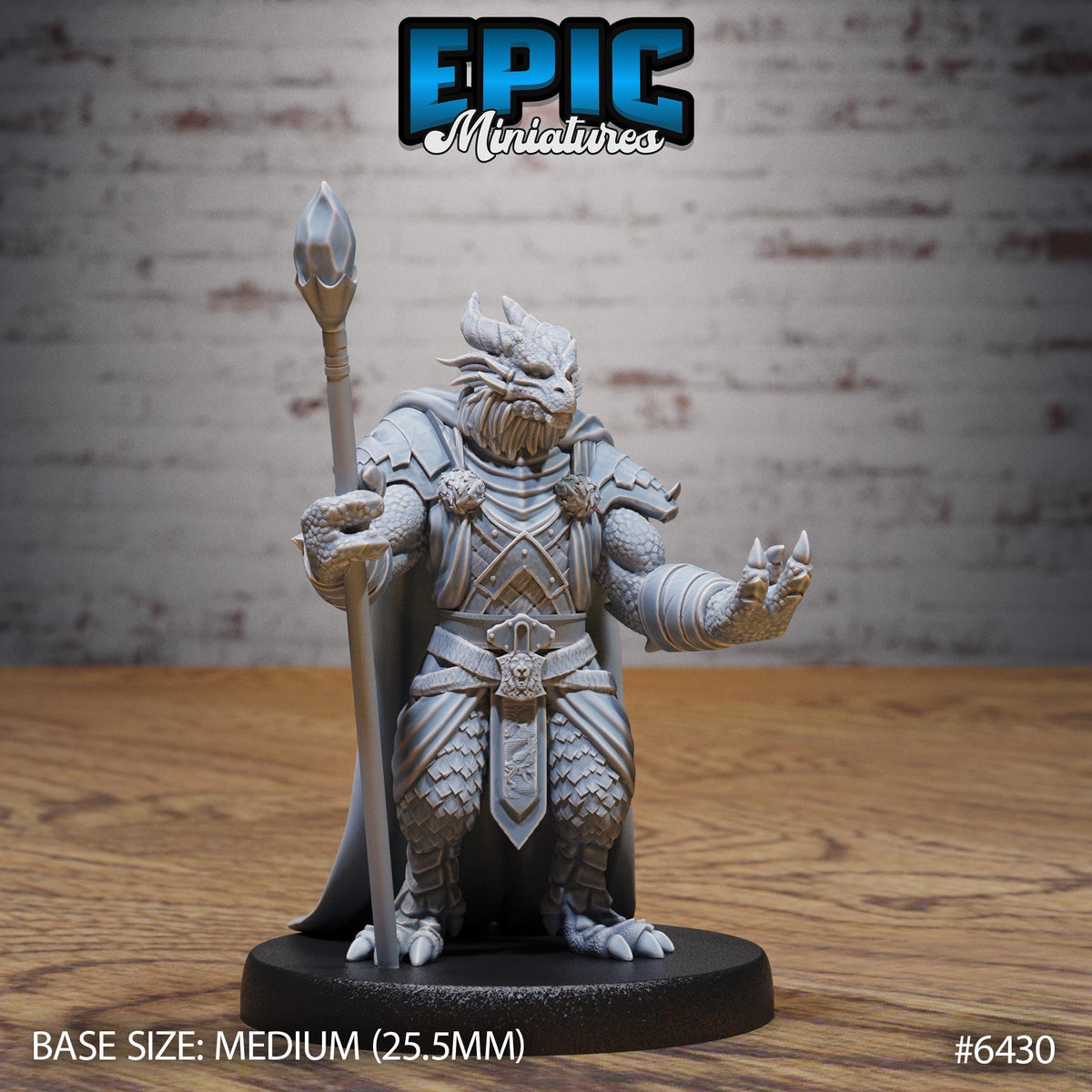 A detailed 3D model of a dragon-like creature, possibly a fantasy minifigure, standing on a wooden surface. The creature is holding a staff and has a fierce expression on its face. The image is labeled with the text "Epic Miniaturies" and "BASE SIZE: MEDIUM (25.5MM)" indicating the size and material of the minifigure.