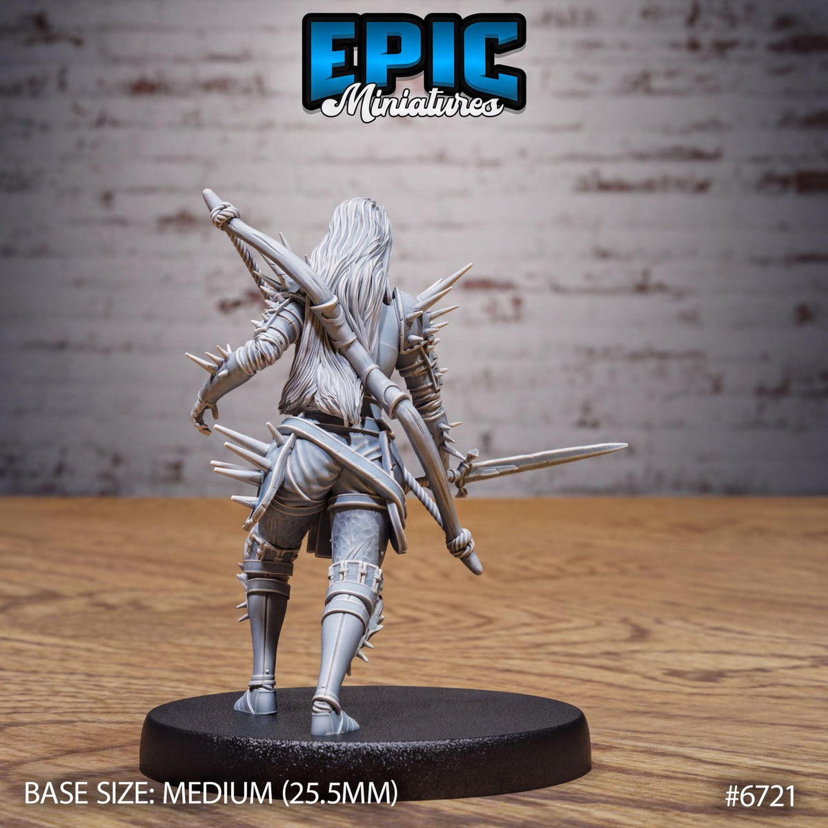 A figurine of a warrior standing on a base, with a sword in hand, against a brick wall background.