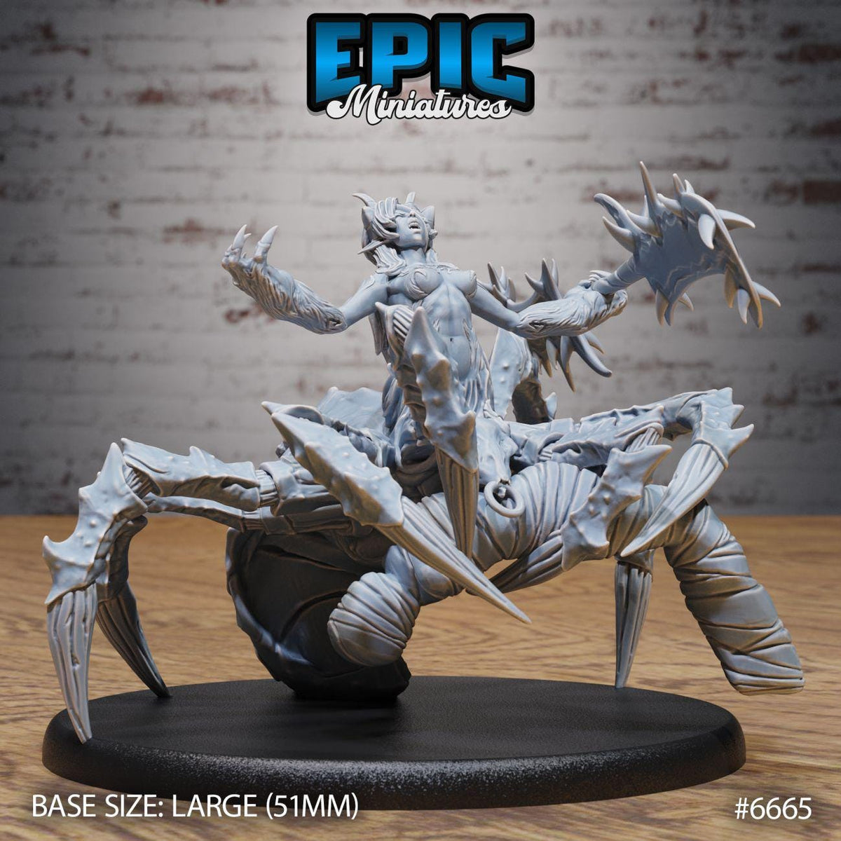 A large figurine of a spider-like creature with sharp claws and a menacing expression, displayed on a black base.