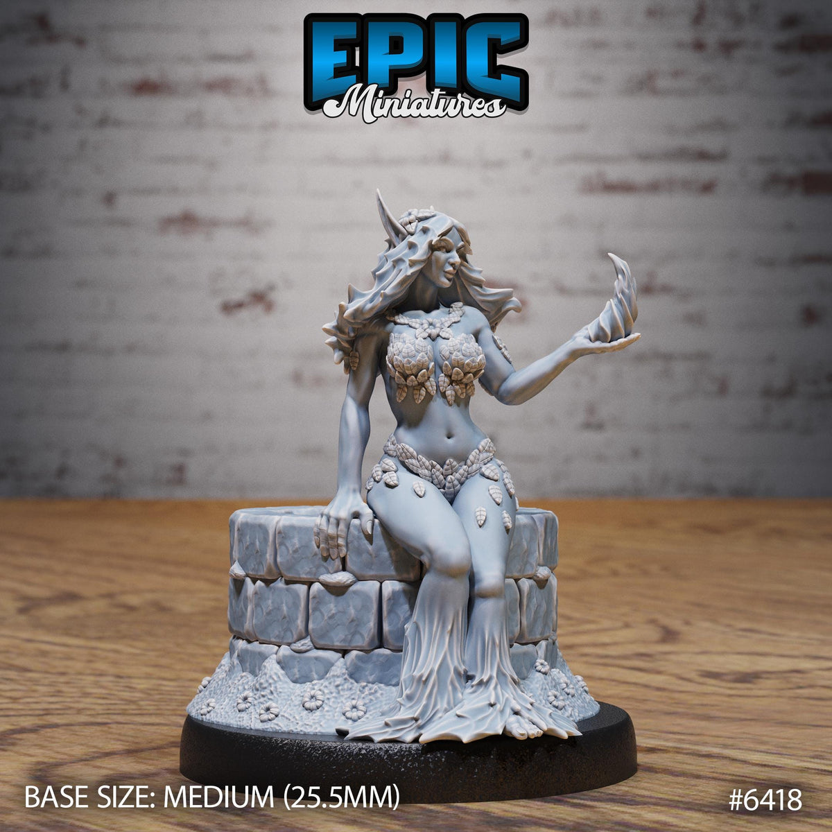 A figurine of a woman with long hair and a flowing dress, sitting on a stone pedestal. The figurine is described as a "MEDIUM" size, with a base size of 25.5 millimeters. The background is a brick wall.
