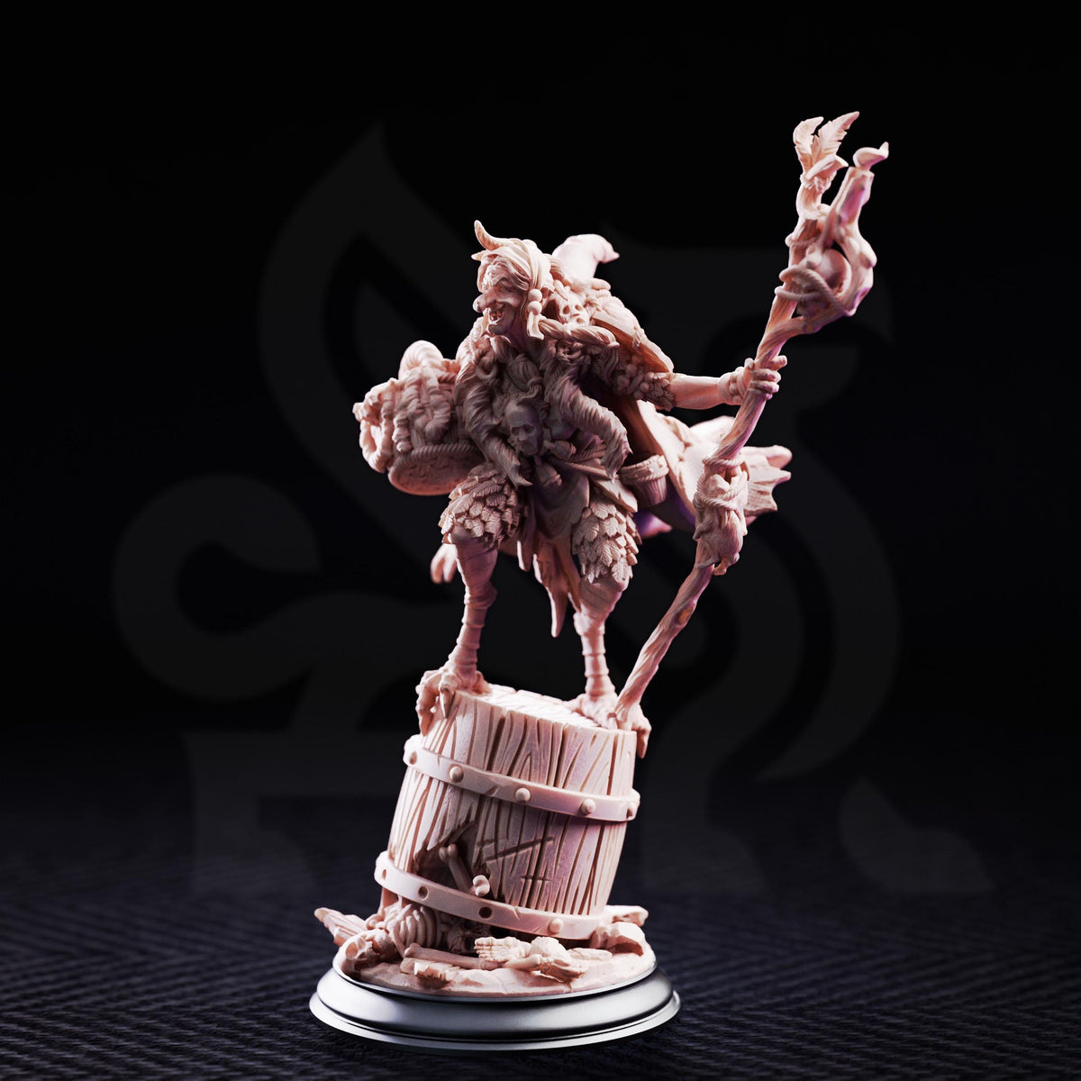 A figurine of a fantastical creature, possibly a dragon or serpent, standing on a barrel and holding a staff or staff-like object.
