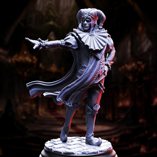 A statue of a jester or performer, with a flowing cape and ornate headdress, standing on a pedestal against a dark background.