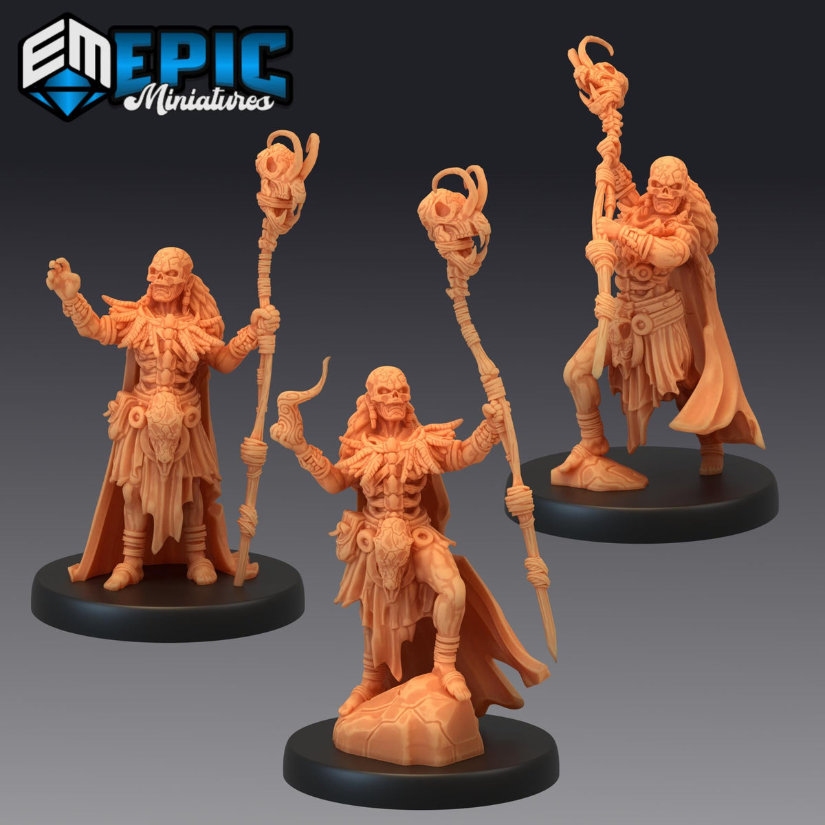 three figurines of fantasy characters, each holding a staff or staff-like object, and they are all standing on black bases.