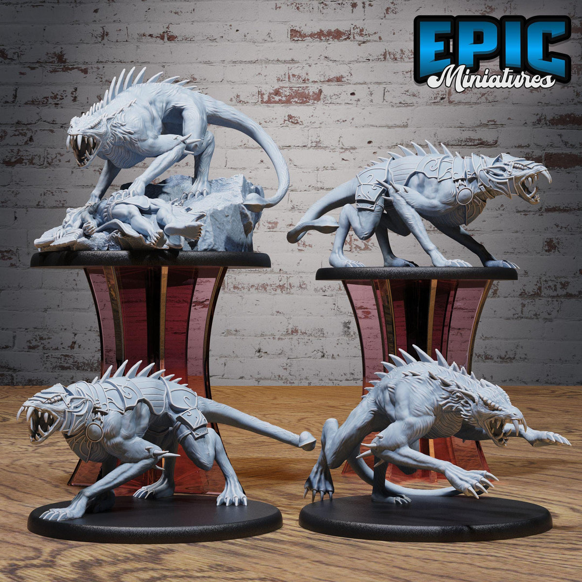 four detailed figurines of fierce-looking creatures, likely miniature models of mythical or fantastical animals, displayed on stands against a brick wall background.