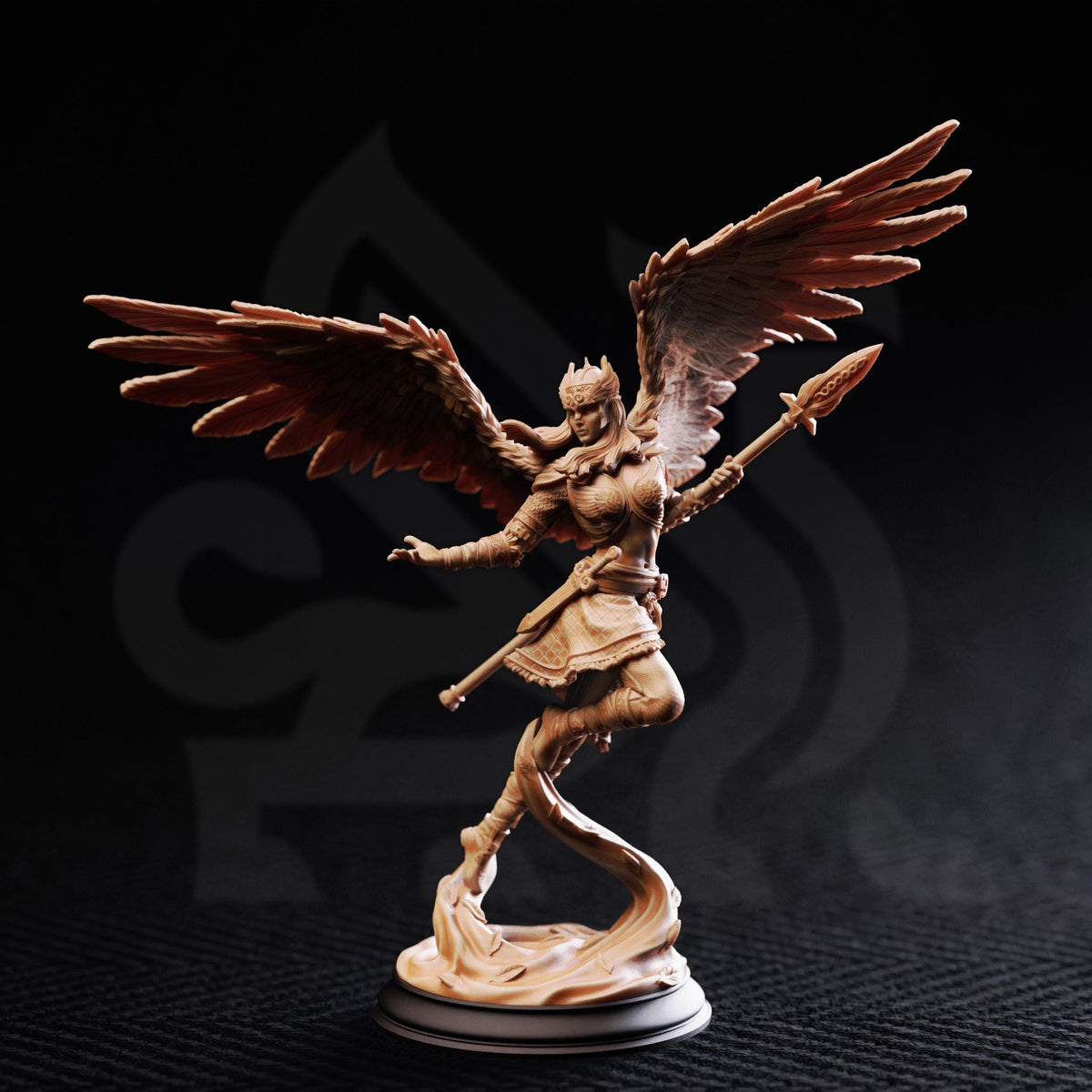 A figurine of a winged female figure with a sword and shield, standing on a pedestal against a dark background.