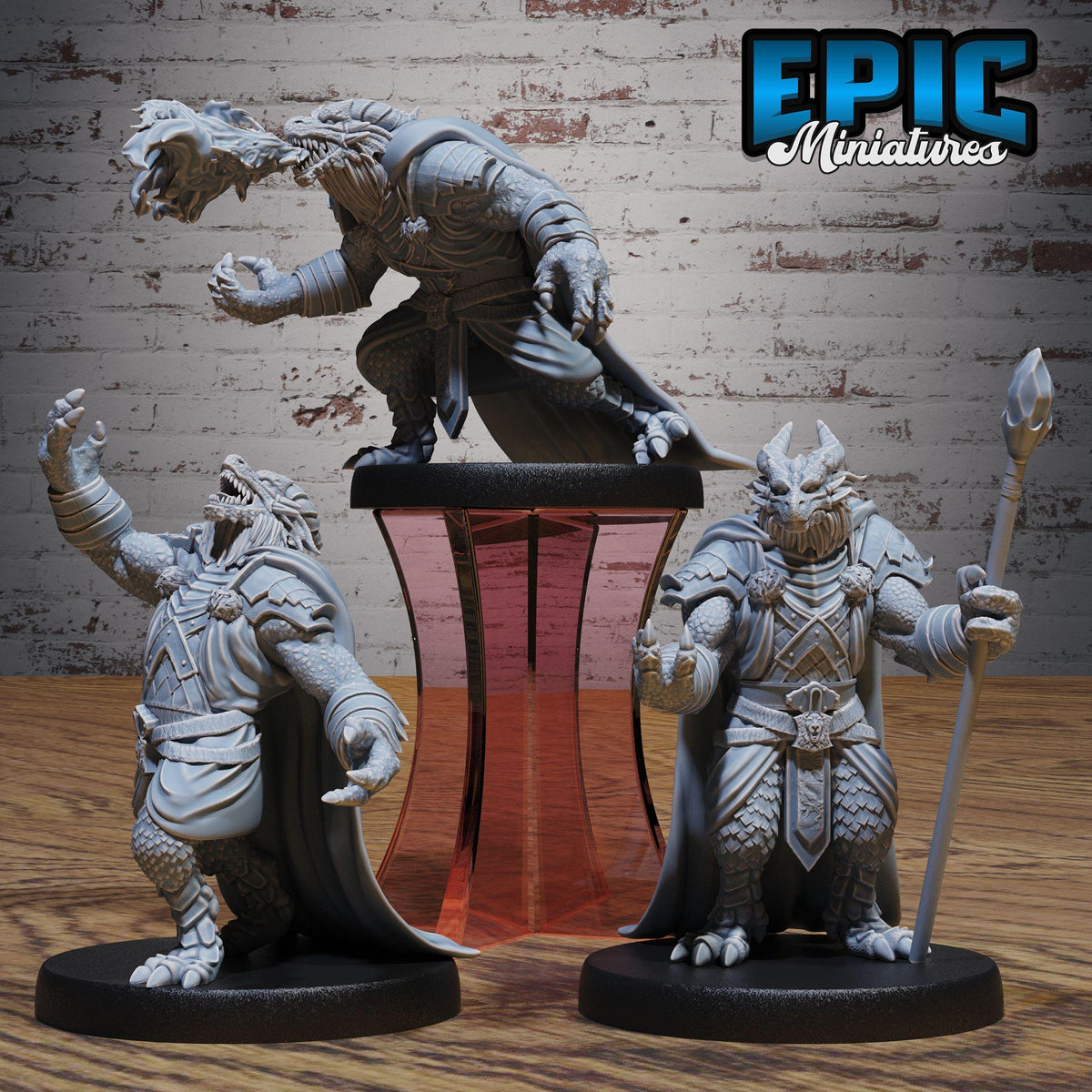 three detailed figurines of fantastical creatures, including a dragon-like creature, a knight-like figure, and a warrior-like character, all posed on a stand against a brick wall background.