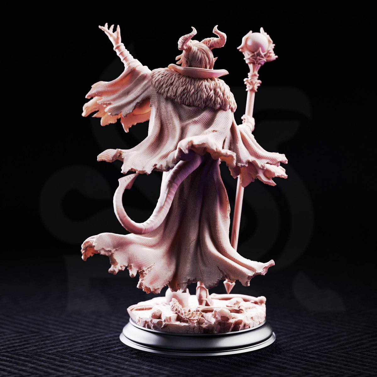 A detailed figurine of a fantastical character with horns, a flowing robe, and a staff, set against a dark background.