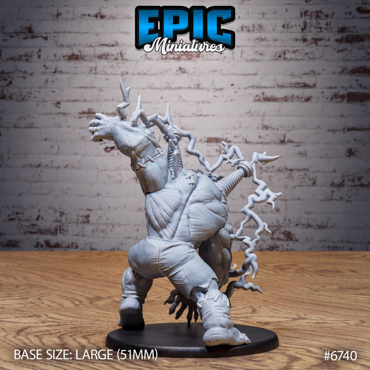 A large, detailed figurine of a monster or creature with a dynamic pose, set against a brick wall background.