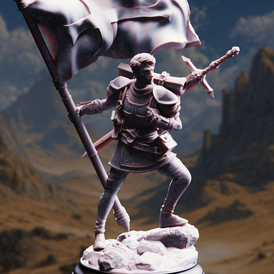 A statue of a person holding a flag and a sword, standing on a rocky base against a mountainous landscape.