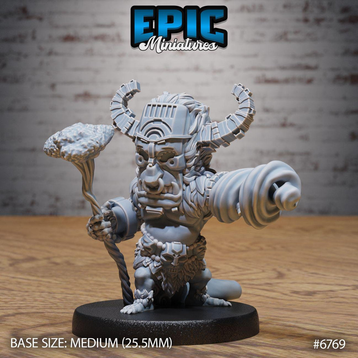 A 3D model of a miniature character, likely a fantasy or science fiction character, with a large head, horns, and a staff. The character is standing on a black base and appears to be in a fighting stance. The image is labeled with the text "Epic Miniaturies" and "BASE SIZE: MEDIUM (25.5MM) #6769".