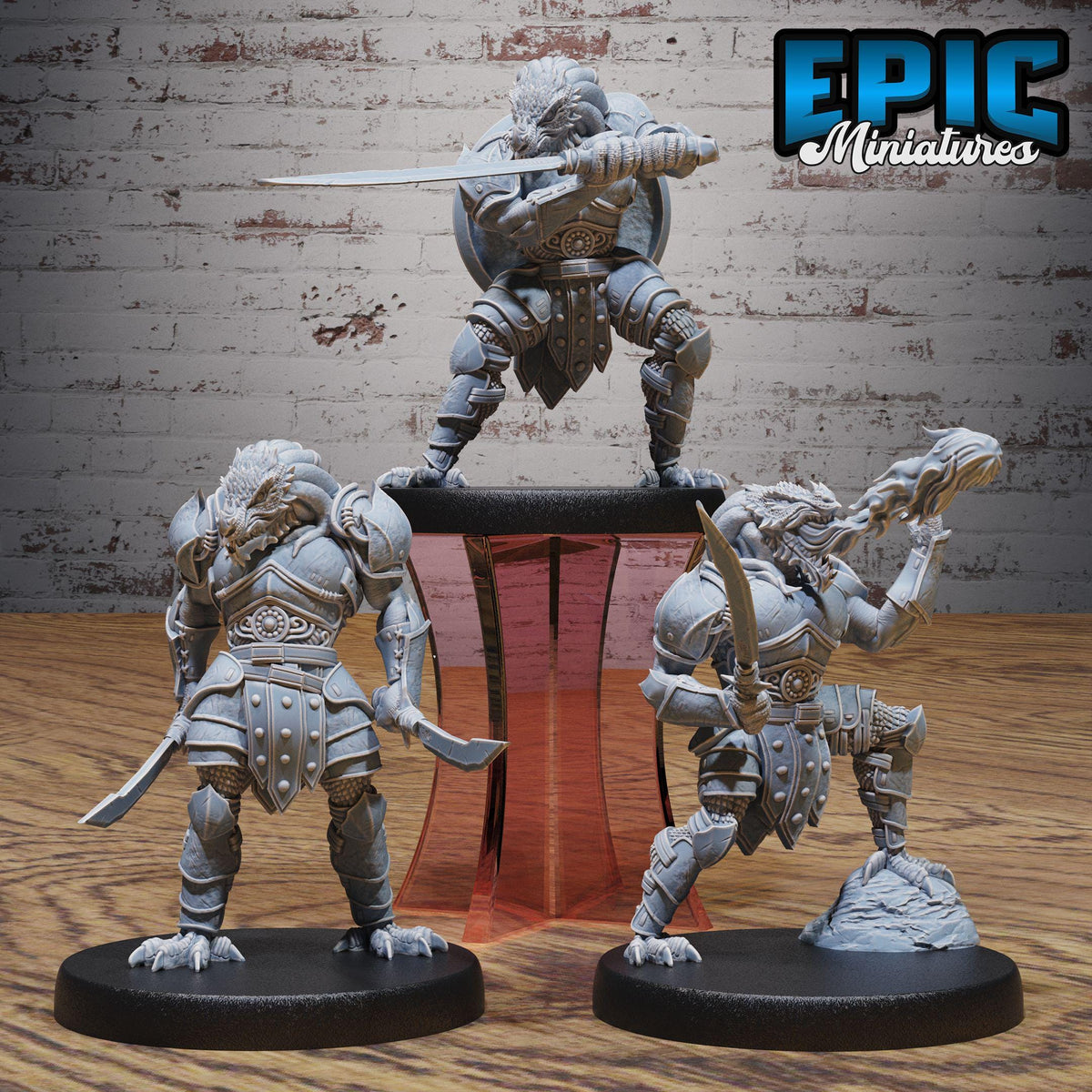 three figurines of dragons, each holding a sword and standing on a platform.