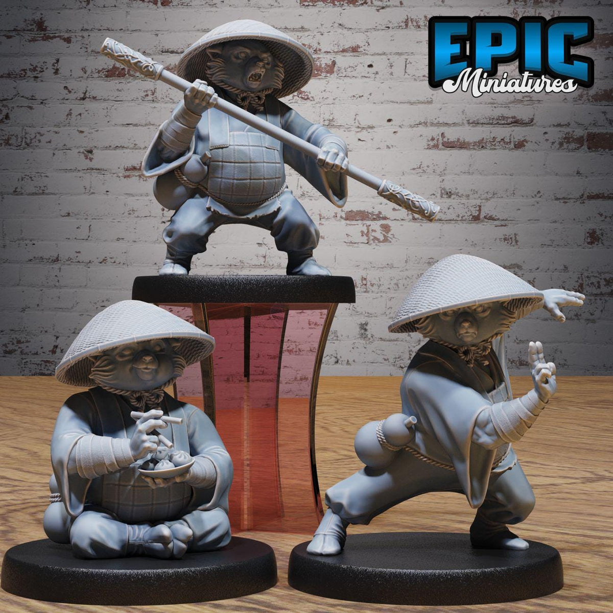 three figurines of characters from a video game, each with unique poses and accessories.