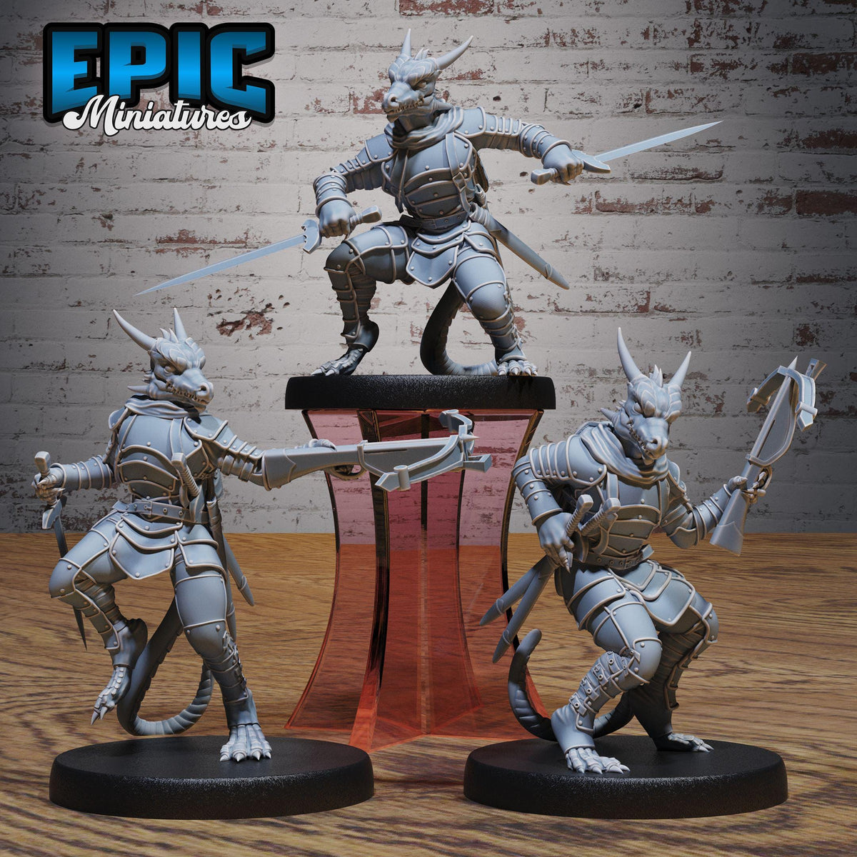 three detailed figurines of dragons, each holding a sword and standing on a platform.